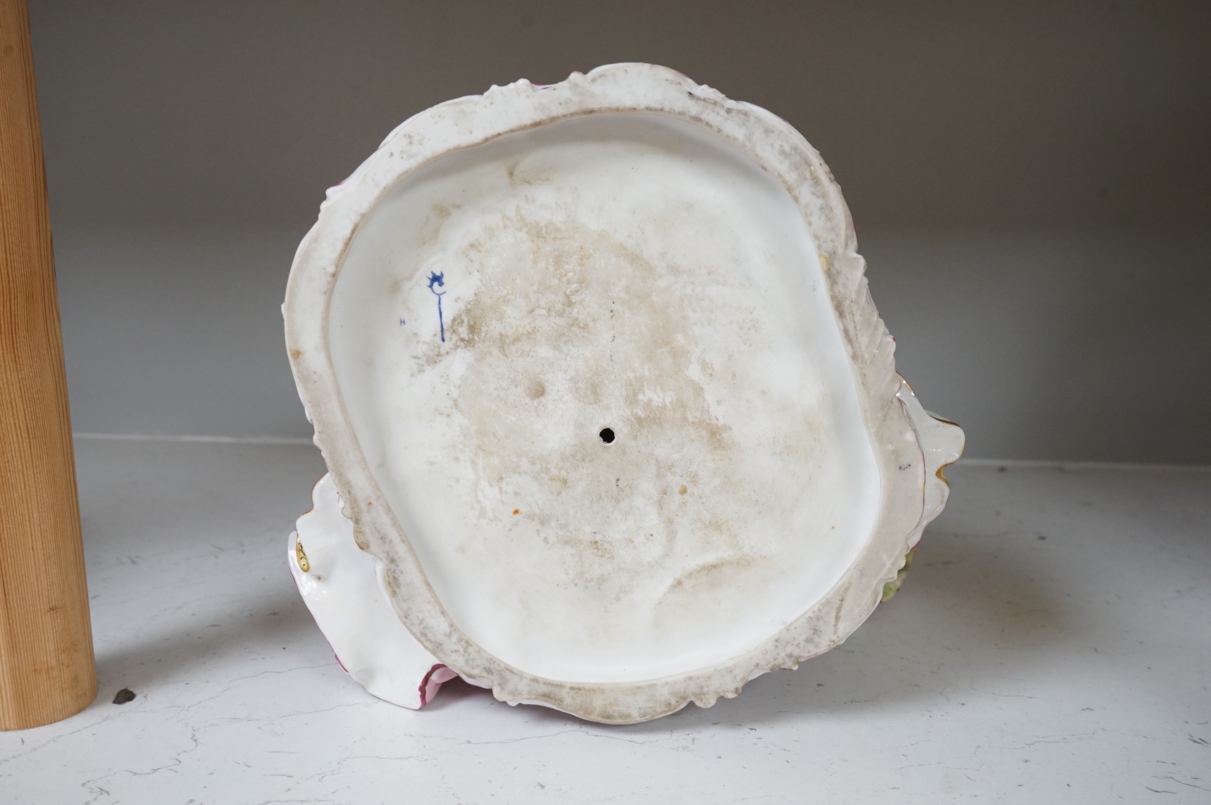 A large German porcelain group lovers at a piano, 22cm high